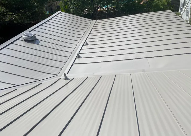 Solar attic fan installed on a metal roof for Roof Ventilation in Meridian